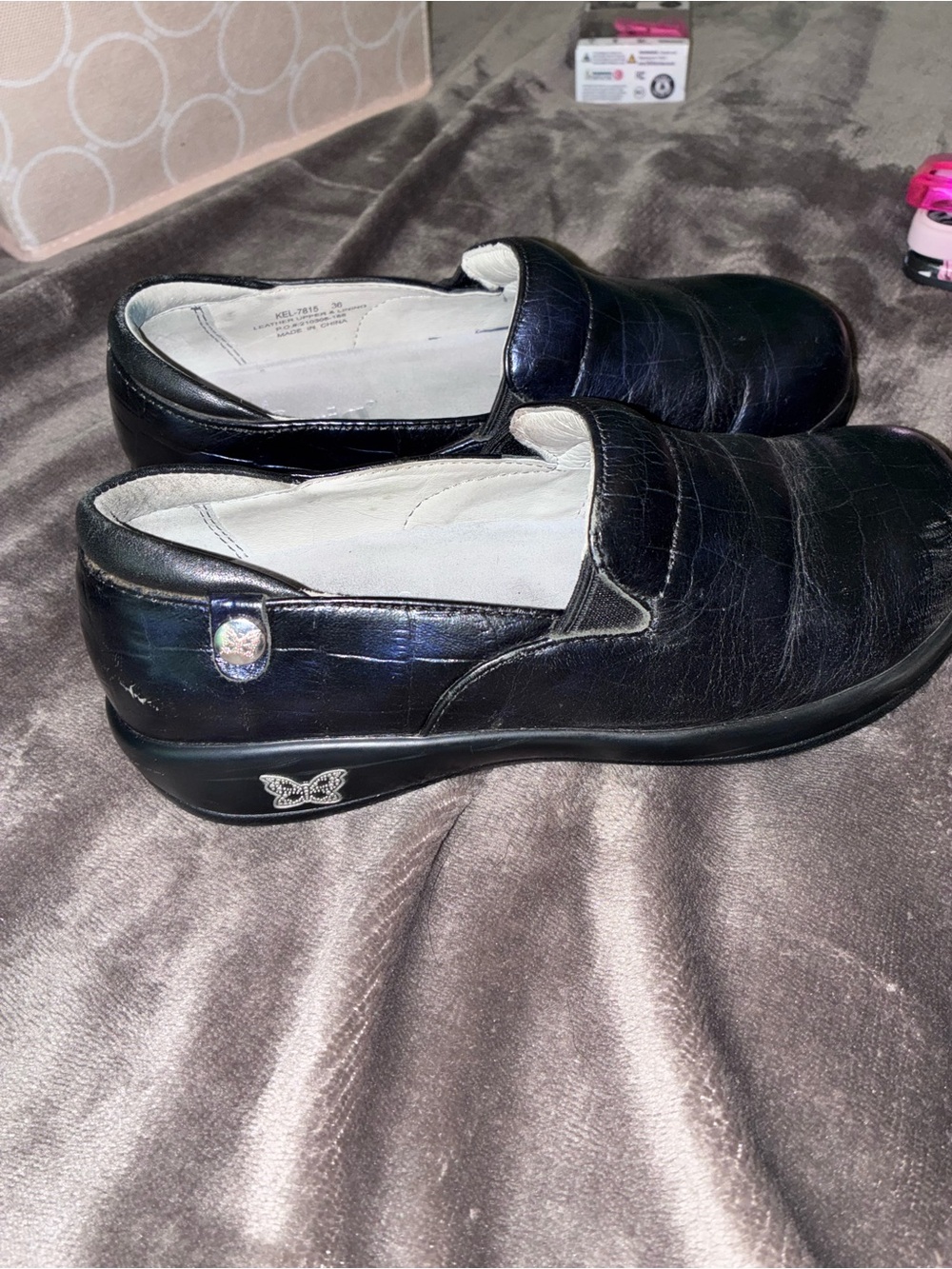 Alegria Black Leather Slip-On Sneakers with Butterfly Accent